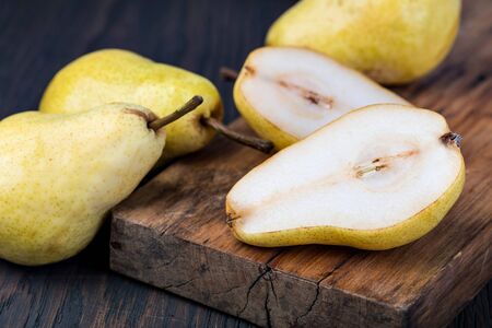 Fresh pears on a wooden kitchen tableの写真素材