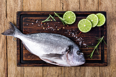 fresh dorado fish on a wooden の写真素材