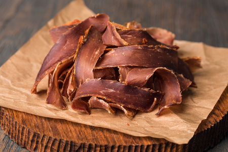 beef jerky and spice on old tableの写真素材