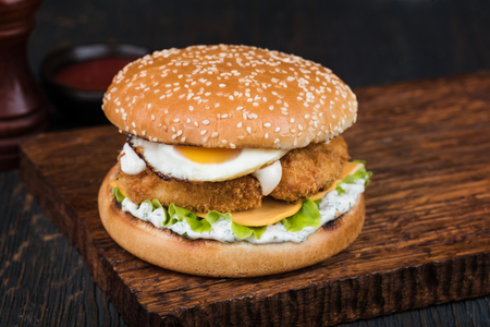 fresh tasty burger on wood tableの写真素材