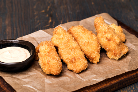 chicken nuggets with sauce on woodenの写真素材