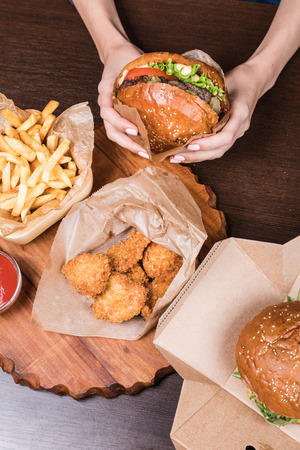 fresh tasty burger on wood tableの写真素材