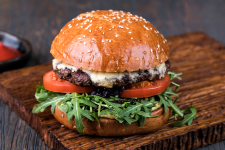 fresh tasty burger on wood tableの写真素材