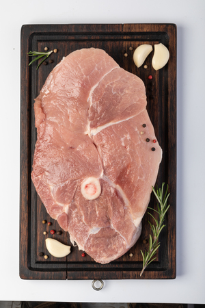 raw pork steak isolated on white backgroundの写真素材