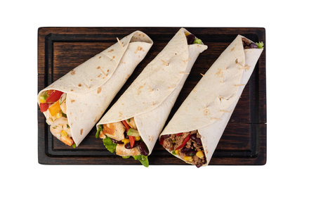 burrito with vegetables and tortilla, isolated on white