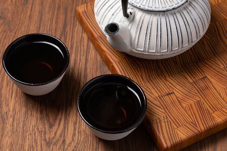 Teapot and Teacups on wooden backgroundの写真素材