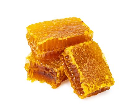 Yellow Honeycomb slice closeup isolated on white backgroundの写真素材