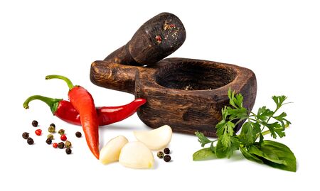 Fresh spices and herbs in mortar isolated on whiteの写真素材