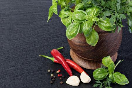 Fresh spices and herbs on a tableの写真素材