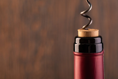 Corkscrew and bottle of wine