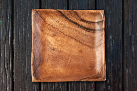 Cutting board on a wooden tableの写真素材