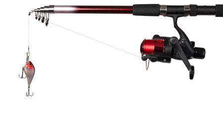 Spinning rod, reel and fishing baits isolated on white background