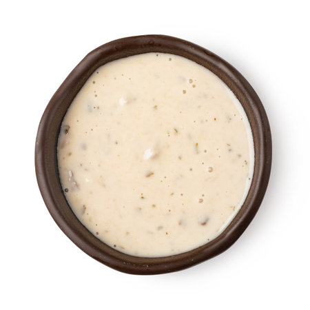 Bowl with mushrooms sauce isolated on white backgroundの写真素材