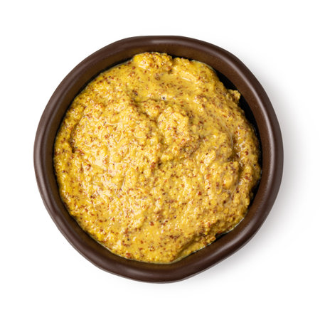 Bowl with mustard isolated on white backgroundの写真素材