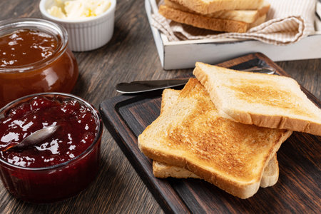 Toast with jam on a wooden table