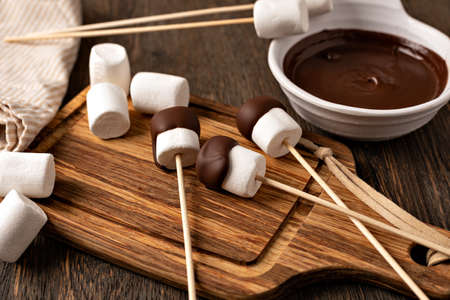 marshmallow on old wooden tableの写真素材