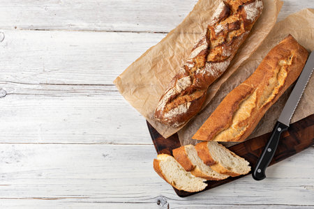 Assortment of baked bread on wooden table