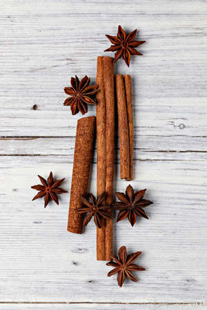 star anise and cinnamon isolated on a wooden backgroundの写真素材