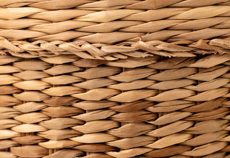 Wicker basket close up photo. wooden backgroundの写真素材