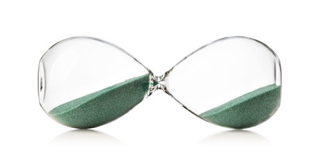 hourglasses with green sand on white background