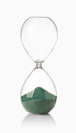 hourglasses with green sand on white backgroundの写真素材