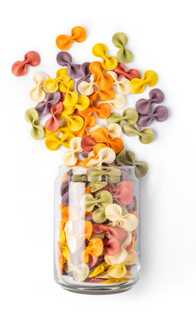 dried italian pasta Farfalle, isolated on white backgroundの写真素材