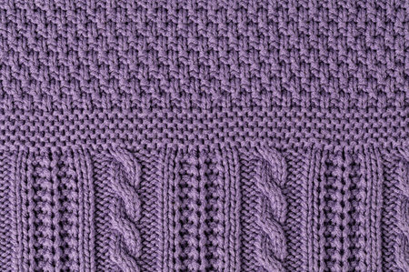 Cropped close up shot of woolen knitting pattern