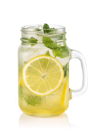 Glass with lemon lemonade and ice isolated on white backgroundの写真素材