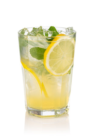 Glass with lemon lemonade and ice isolated on white backgroundの写真素材
