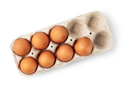 chicken eggs in a paper box on a white backgroundの写真素材