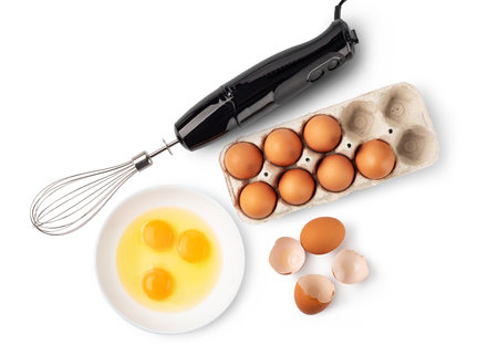 chicken egg and immersion blender isolated on white backgroundの写真素材