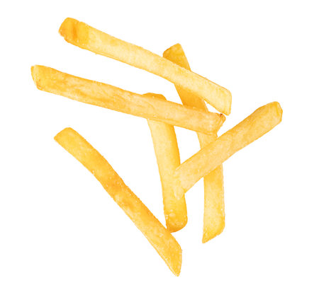 Crispy golden french fries falling against a white background, creating a tempting image of this...