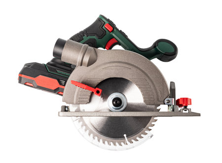 A circular saw power tool with a green handle and a silver blade. The blade is sharp and ready to cut. Isolated on a white backgroundの写真素材