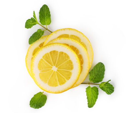 Lemon slices with mint leaves create a refreshing image, perfect for food and beverage projectsの写真素材