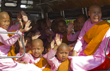 Little girl monks greeting in a vanのeditorial素材