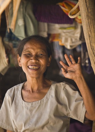 Old asiatic woman greets usのeditorial素材