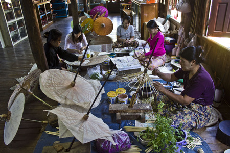 Doing Typical Myanmar Umbrellas  Umbrellas are pure handmade and organic  Every process are done by manual hand and all material used to make umbrella are come from nature  のeditorial素材