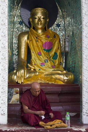 Praying at the Buddha のeditorial素材