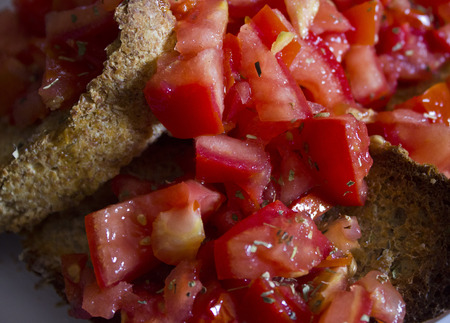 Typical Italian bruschetta  Toasted bread, fresh tomatoes, garlic, oil, oregano and sault  An easy recipe for all tastes の写真素材