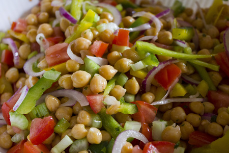 Garbanzo Bean Salad. A fresh chickpea salad for the summer season, done with raw vegetables such as onion, green pepper, celery, tomato and parsley. An healthy an easy recipe!の写真素材