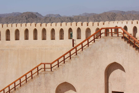 Nizwa Fort Castle. The Nizwa Fort is a massive castle in Nizwa, Oman. It is Oman's most visited national monument. It is unique among other forts in Oman due to the cylindrical shape of its main tower. The fort also contains many exhibits and artefacts diの写真素材