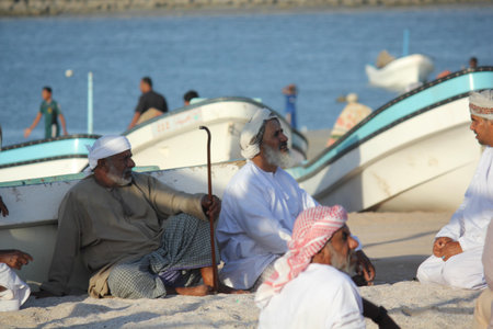 Sur, Oman, October 22, 2013. Fishermen take refuge from the sun on the beach in Oman