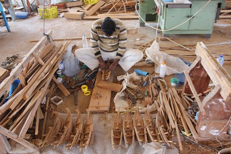 Sur, Oman, October 23, 2013: Man at work building a boat. Boat in Oman are built manually using woodのeditorial素材