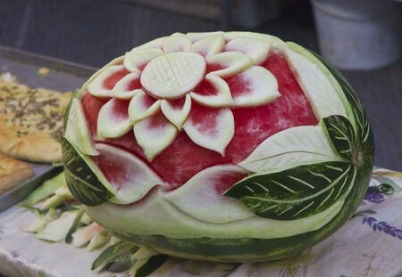 Watermelon cutting Art. Beautiful decorated watermelon on a street market in Tuscany, Italyの写真素材