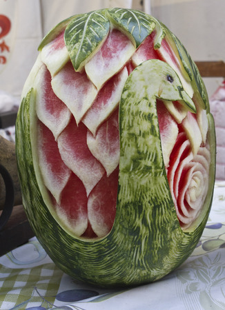 Watermelon cutting Art. Beautiful decorated watermelon on a street market in Tuscany, Italyの写真素材