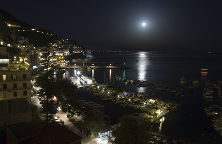 Amalfi, Italy, August 11, 2014: Amalfi Coast by night. The Amalfi Coast (Italian: Costiera Amalfitana) is a stretch of coastline on the southern coast of the Sorrentine Peninsula in the Province of Salerno in Southern Italyのeditorial素材
