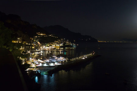 Amalfi, Italy, August 11, 2014: Amalfi Coast by night. The Amalfi Coast (Italian: Costiera Amalfitana) is a stretch of coastline on the southern coast of the Sorrentine Peninsula in the Province of Salerno in Southern Italyのeditorial素材