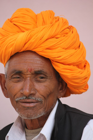 Pushkar, India, November 28, 2012: Senior Indian Man with orange turbanのeditorial素材