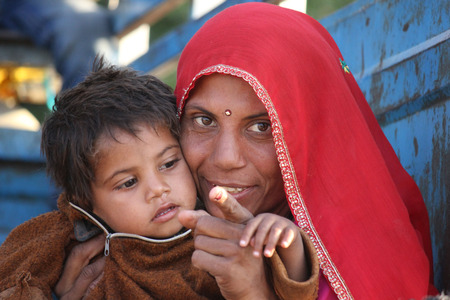 Pushkar, India: A beautiful Indian Mum with her sonのeditorial素材
