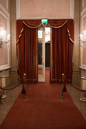 Venice, Italy, June 5 2014: La Fenice Theatre door entrance, with the traditional red carpet and curtainのeditorial素材